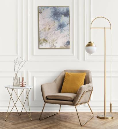 Picture frame by a velvet armchair Picture frame by a velvet armchair